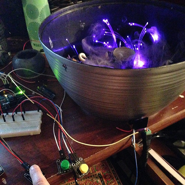 scrying mirror  miniature with lit LED fiber optics being tested inside a bowl