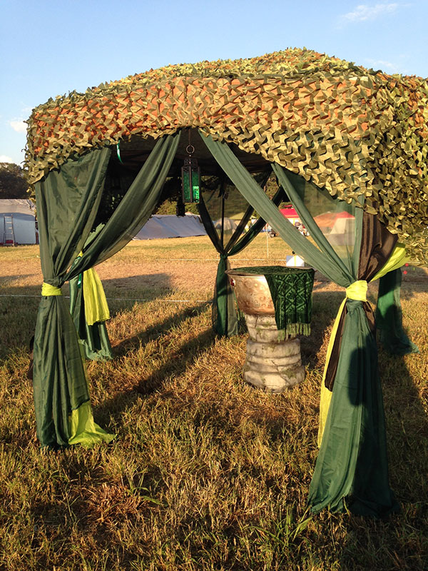 scrying mirror from the back, under a canopy in the sun shining