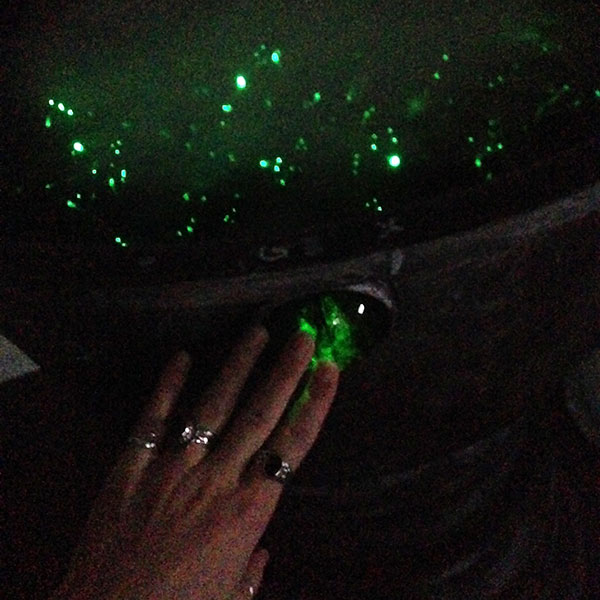 scrying mirror green fiber optics being activated by a hand touching the green button on the side of the bowl