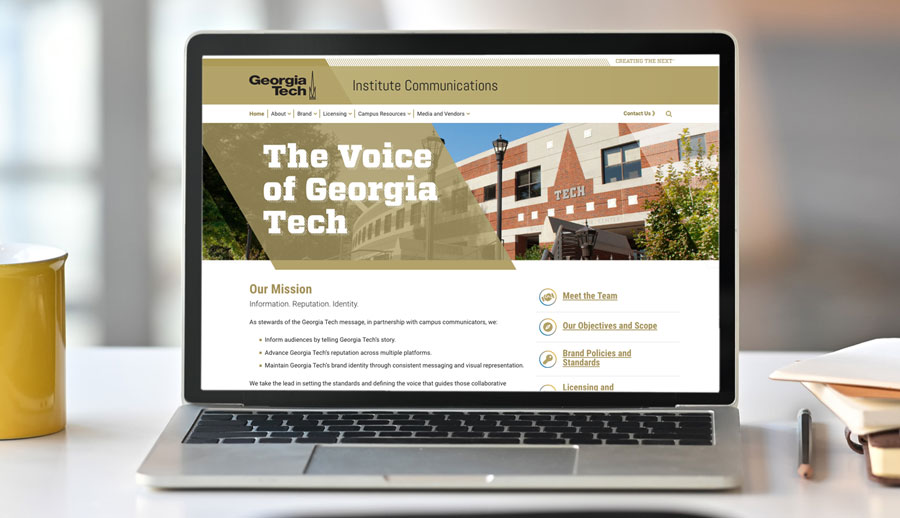 mockup of the Institute Communicatios website on a laptop